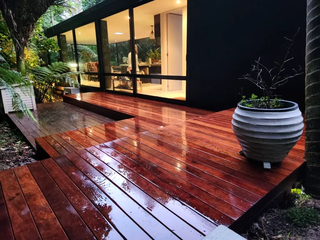 A finished kwila deck at dusk in West Auckland