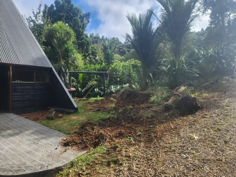 Before: Timber retaining wall and ready lawn levelling in Titirangi