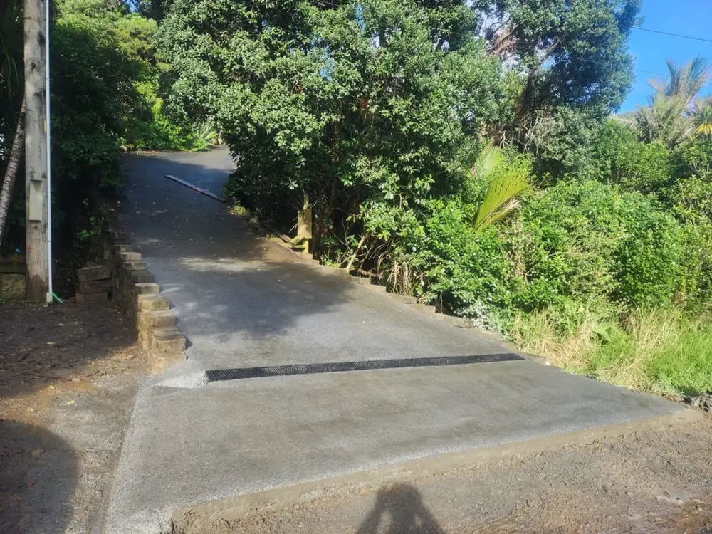 After: Concrete driveway installation and retaining wall in Titirangi
