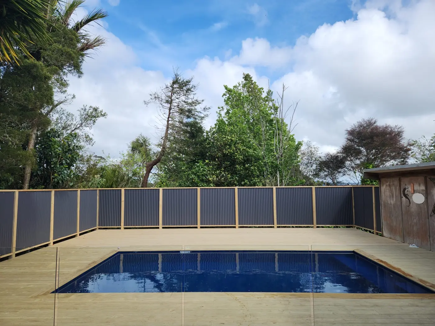 Pool fencing and paving completed at a West Auckland property