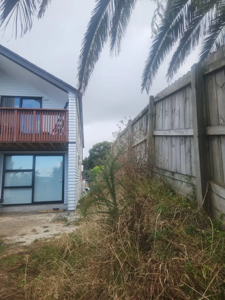 Before: Timber retaining wall and drainage in Massey