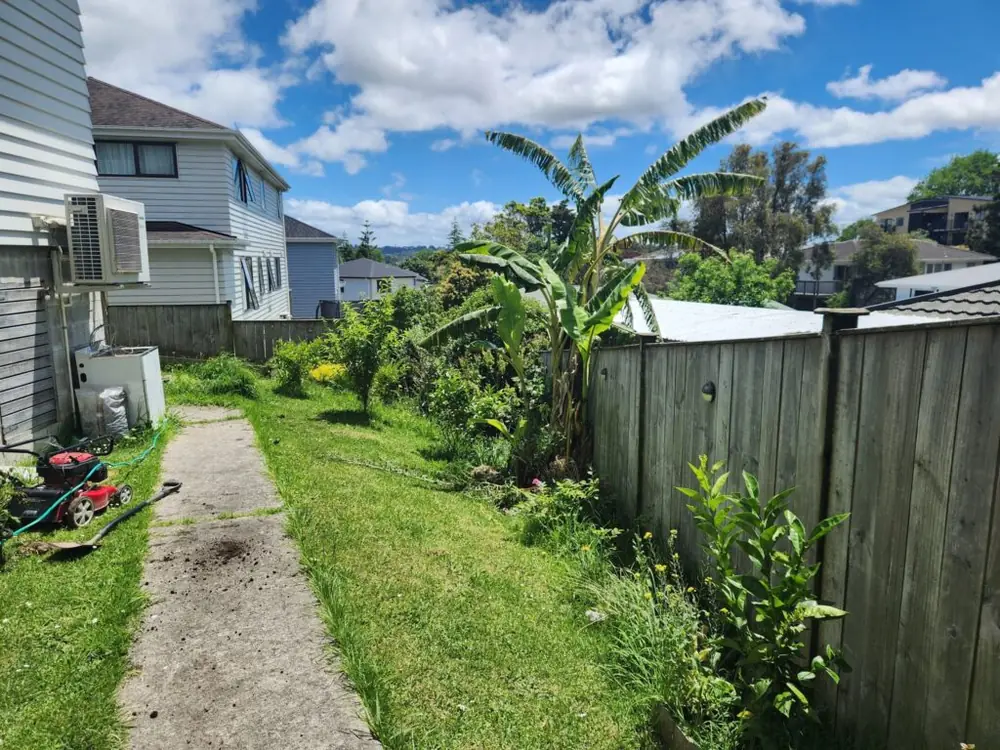 Before: Retaining wall and backyard landscaping in Ranui